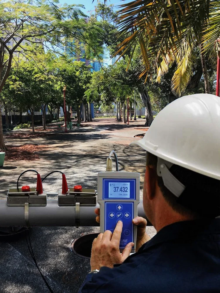 A flow monitoring device in an urban setting, part of Flotech's SSES solutions, highlighting environmental monitoring technol